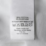 When you upload this to your blog, make sure the Alt Text says: "Close up of stained clothing with price tag still attached - return fraud example."